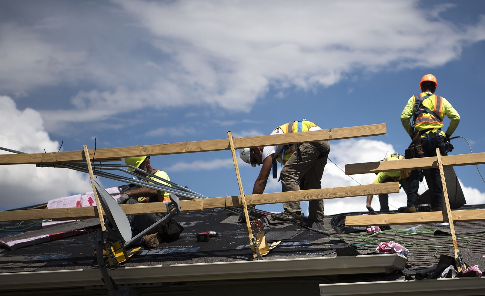 Prairie Fox crew setting trusses and decking on a roof